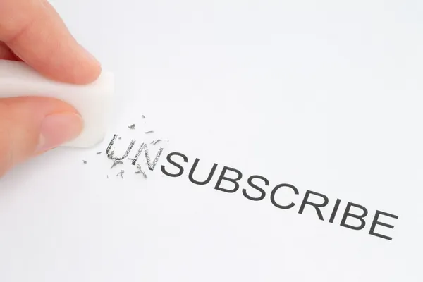 Hand erase part of the unsubscribe word — Stock Photo, Image