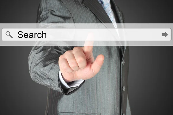 Businessman pushing virtual search bar — Stock Photo, Image