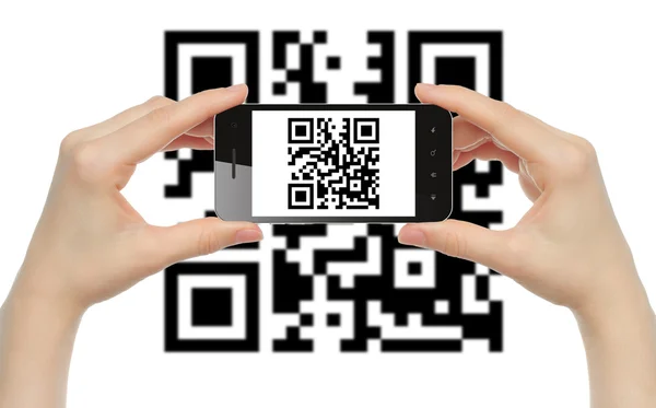 Hands hold smart phone with QR code — Stock Photo, Image