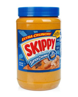 Kiev, Ukraine - January 27, 2022: Jar of peanut butter Extra Crunchy Skippy Super Chunk, on white background