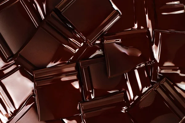 Melted Dark Chocolate Bars background close-up