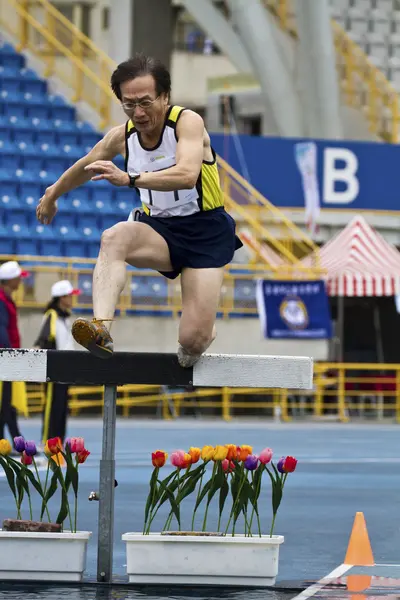 Elderly track and field game — Stock Photo, Image