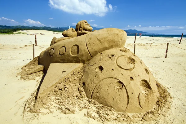 Romanen sand skulptur på fulong beach — Stockfoto