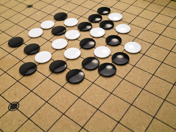Stones on a Go board — Stock Photo, Image