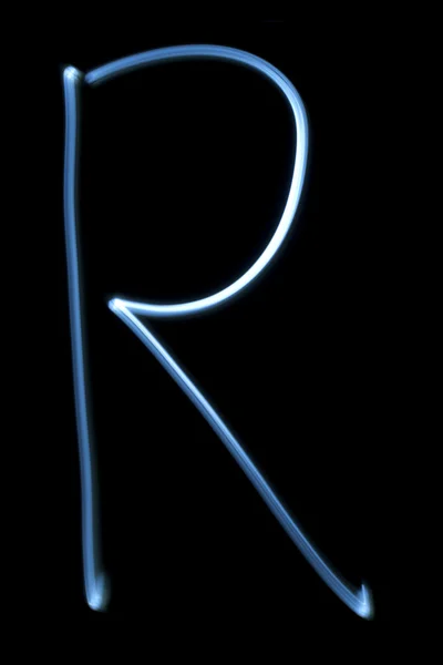 Písmeno r od neon light. — Stock fotografie