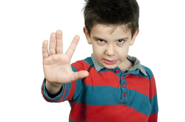 Malý chlapec ukazuje zastavení s rukou — Stock fotografie