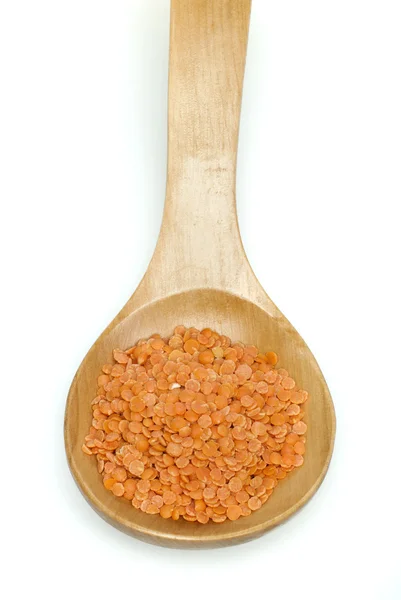 Lentil split in wooden spoon — Stock Photo, Image