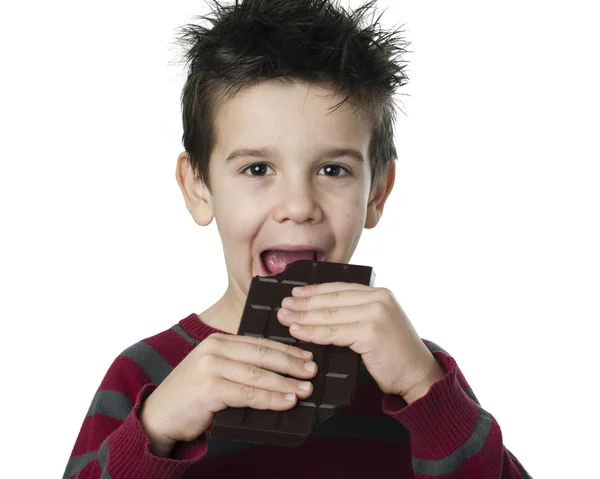 Smiling kid eating chocolate — Stock Photo, Image