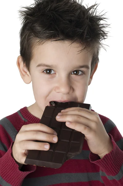 微笑着孩子吃巧克力 — 图库照片
