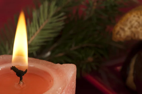 Christmas candle on the festive table — Stock Photo, Image