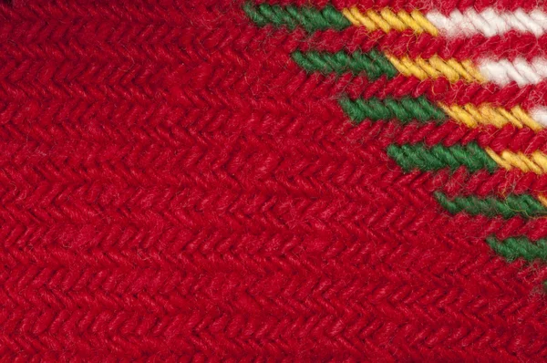 Ручной вязаный зеленый и красный фон — стоковое фото