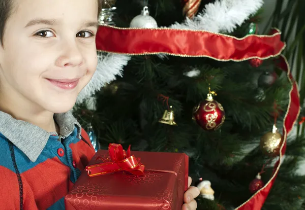 Happy child receive the gift of Christmas Stock Picture