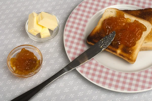 Spread jam on bread — Stock Photo, Image