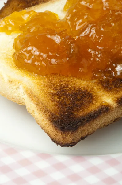 Spread jam on bread — Stock Photo, Image
