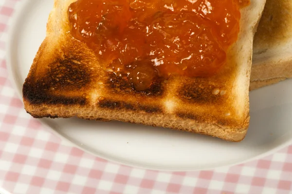 Spread jam on bread — Stock Photo, Image