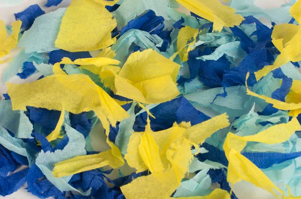 Mnoho barevných kousků roztrženého papíru — Stock fotografie