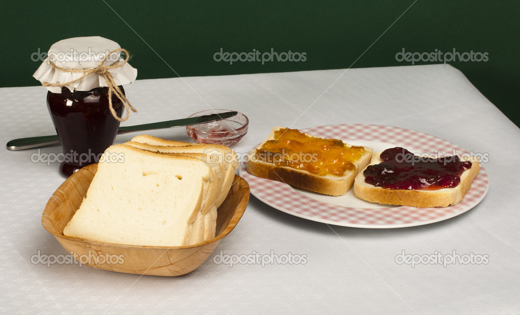 Spread jam on bread Stock Photo by 18083859