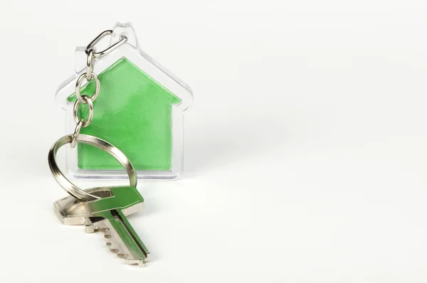 Kulcstartó-zöld ház alak — Stock Fotó