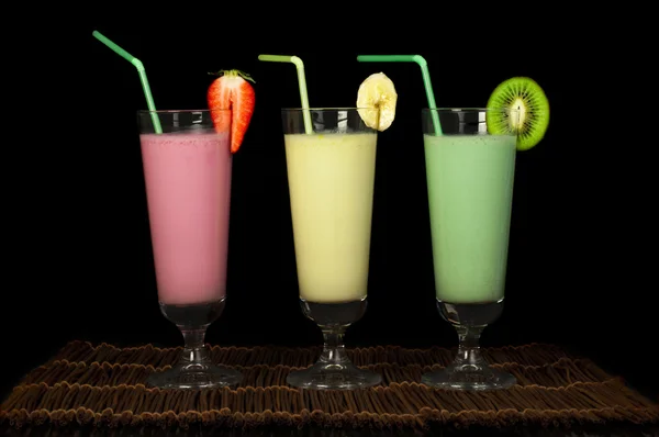 Banana, kiwi and strawberry milk shake and fresh fruis — Stock Photo, Image