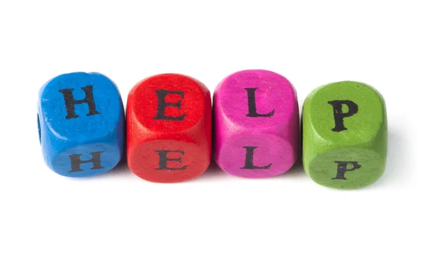 Word help on multicolored wooden cubes — Stock Photo, Image