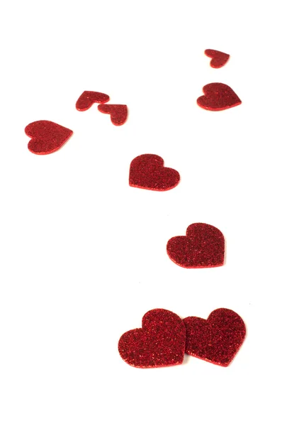 Red shiny hearts on white background — Stock Photo, Image