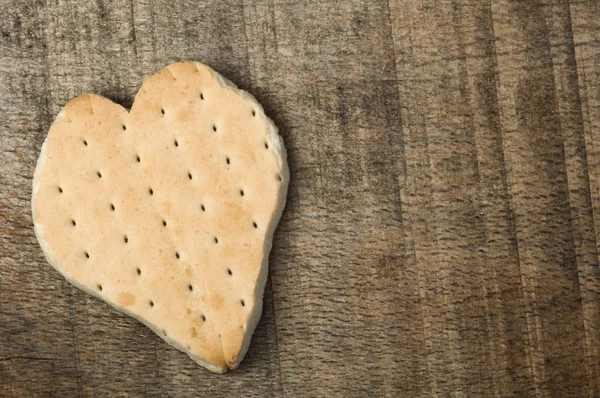 Heart shape cookie on wooden background — Stock Photo, Image