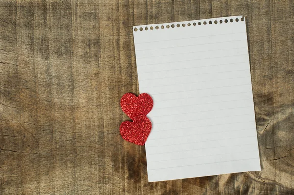 Red hearts and white paper sheet — Stock Photo, Image