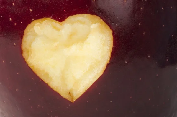 Heart shape closeup carved in apple — Stock Photo, Image
