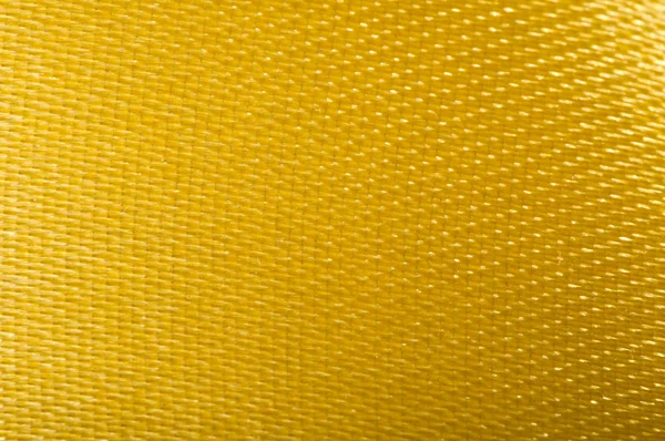 Жовтому тлі сатин — стокове фото