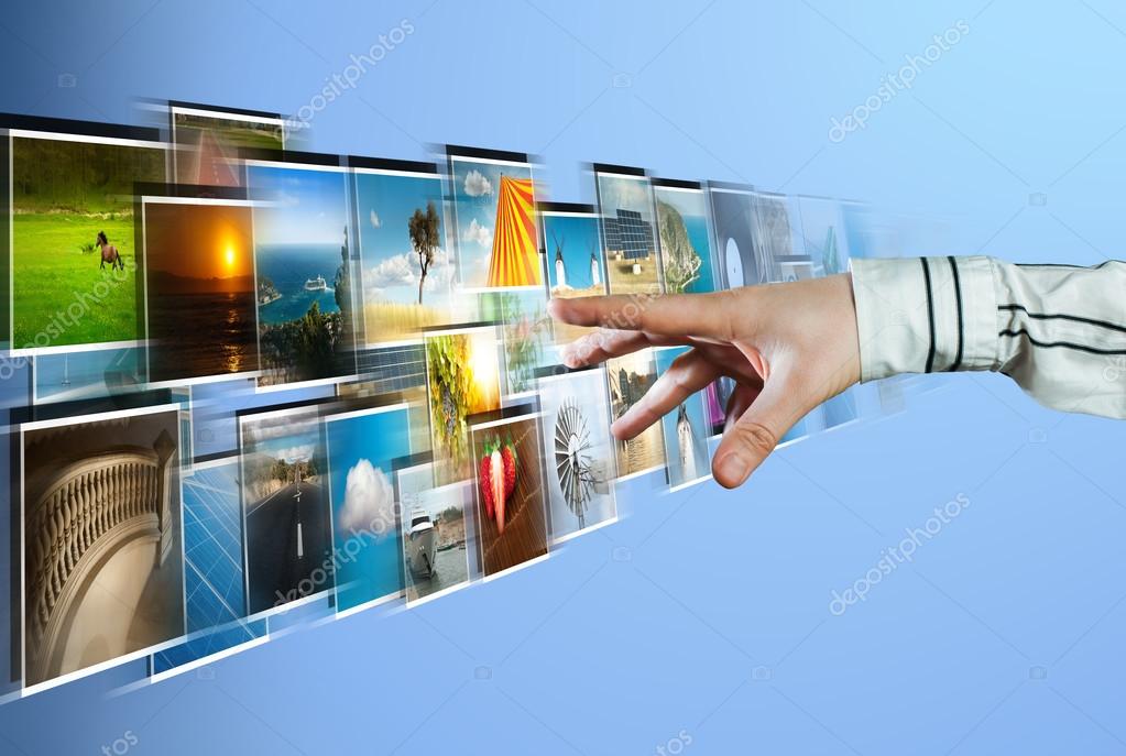 Hand reaching images streaming from the deep on blue background