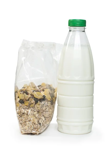 Muesli breakfast in package and bottle milk — Stock Photo, Image