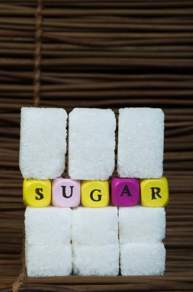 Morceaux de sucre et texte — Photo