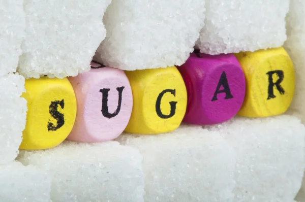 Morceaux de sucre et texte — Photo