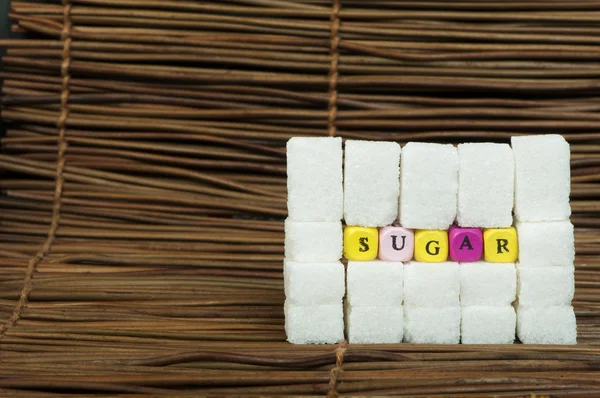 Socker klumpar och text — Stockfoto