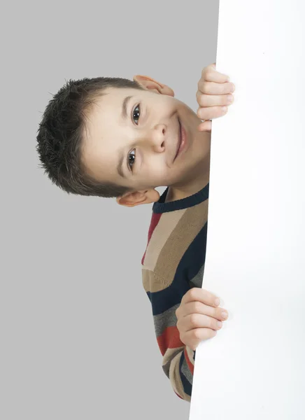 Menino segurando um quadro branco — Fotografia de Stock