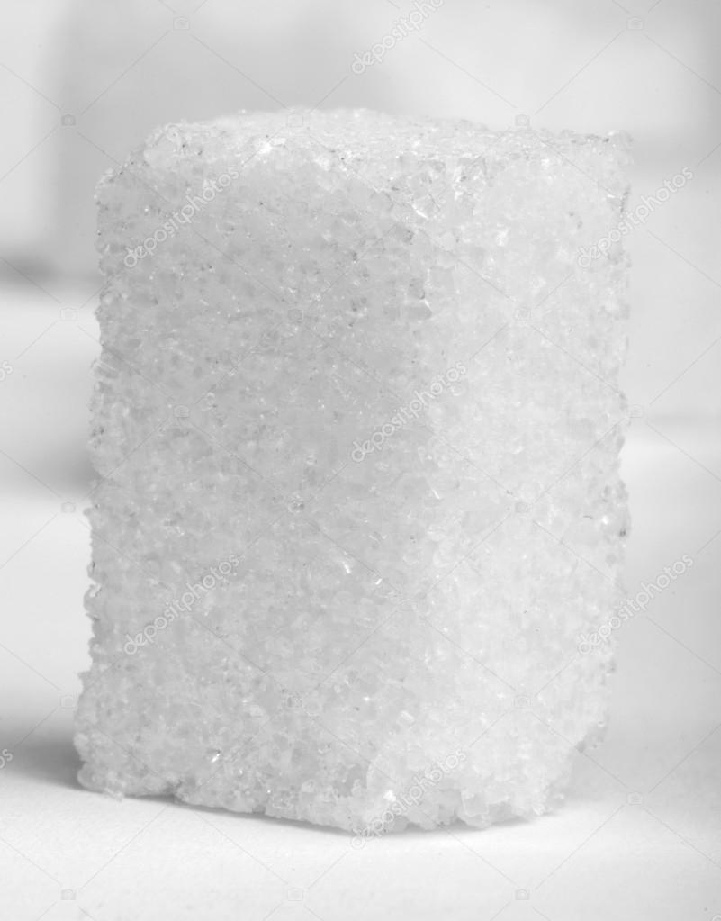 Sugar lumps on white isolated — Stock Photo © 21721083