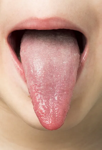 Human tongue protruding out — Stock Photo, Image