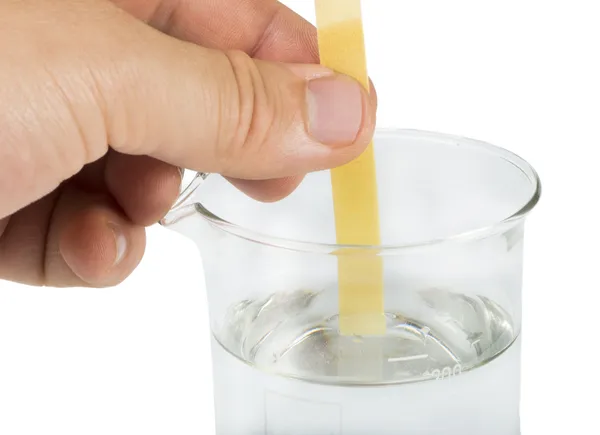 Litmus paper and beaker