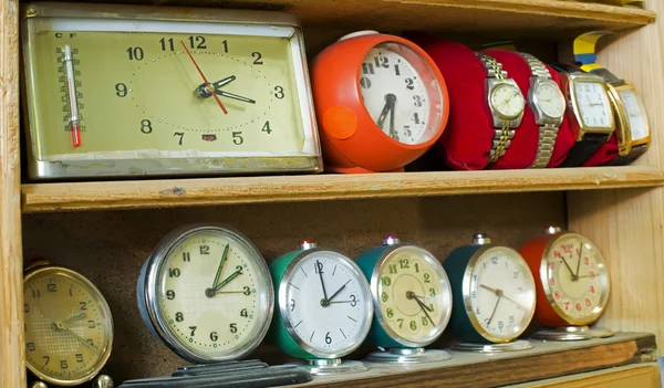 Old clocks on a shelf — Stock Photo, Image