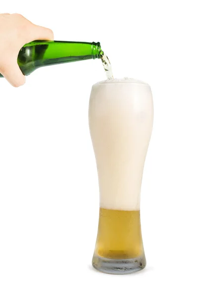 Hand holding bottle of beer and beer mug — Stock Fotó