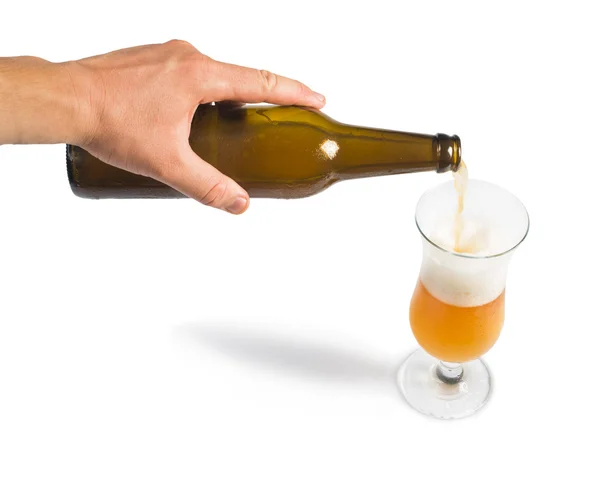 Hand holding bottle of beer and beer mug — 스톡 사진