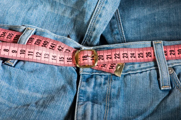 Jeans and centimeter — Stock Photo, Image