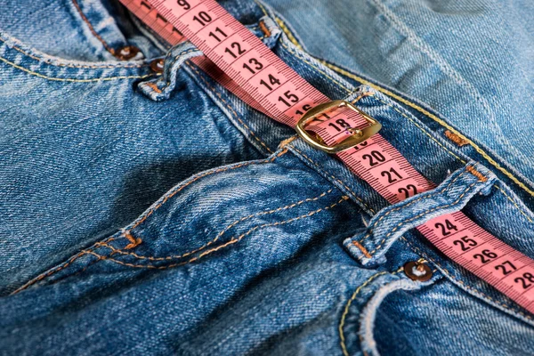 Jeans and centimeter — Stock Photo, Image