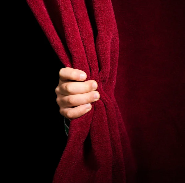 Hand appearing beneath the curtain. — Stock Photo, Image