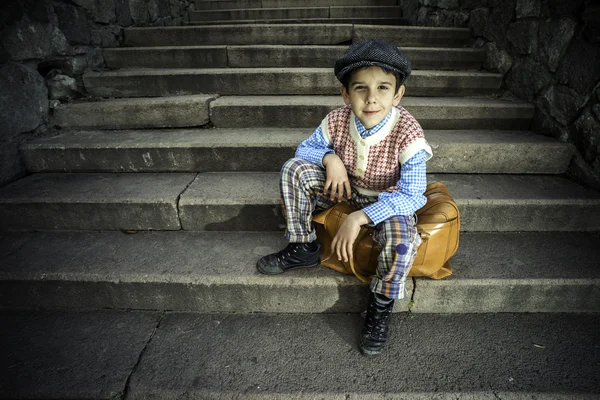 Exterior stairs and child with vintage bag — Stock Photo, Image