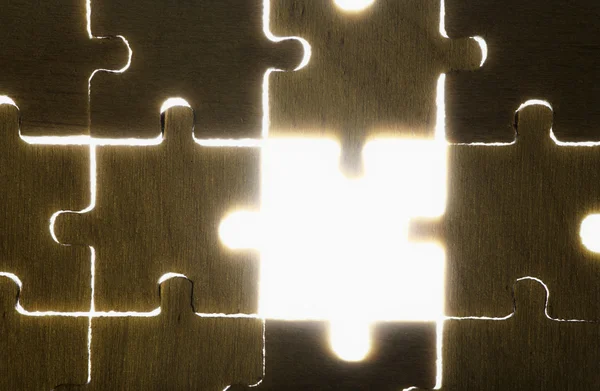 Wooden puzzle and backlight background — Stock Photo, Image