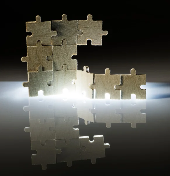 Wooden puzzle and backlight background. Close up — Stock Photo, Image