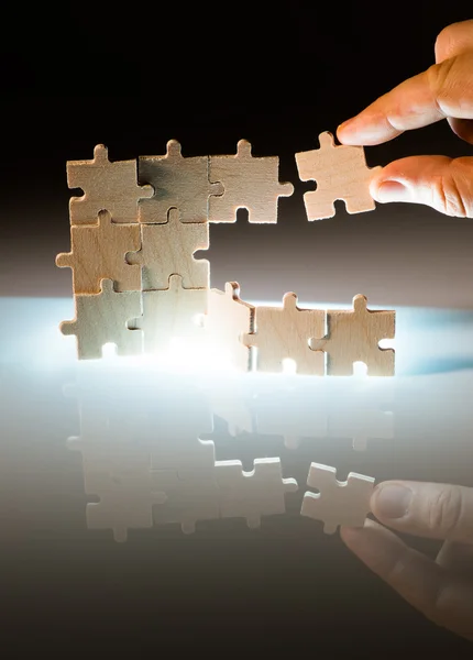 Wooden puzzle and backlight background. Close up — Stock Photo, Image