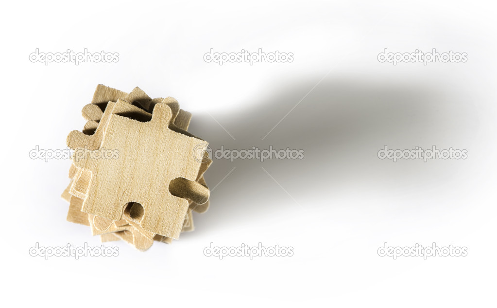 Wooden puzzle on white background. 