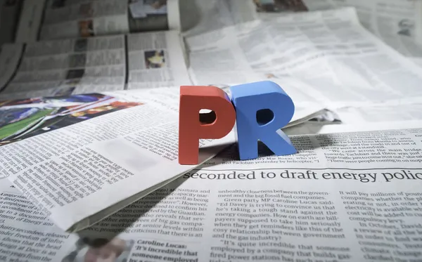 Word PR on newspaper — Stock Photo, Image